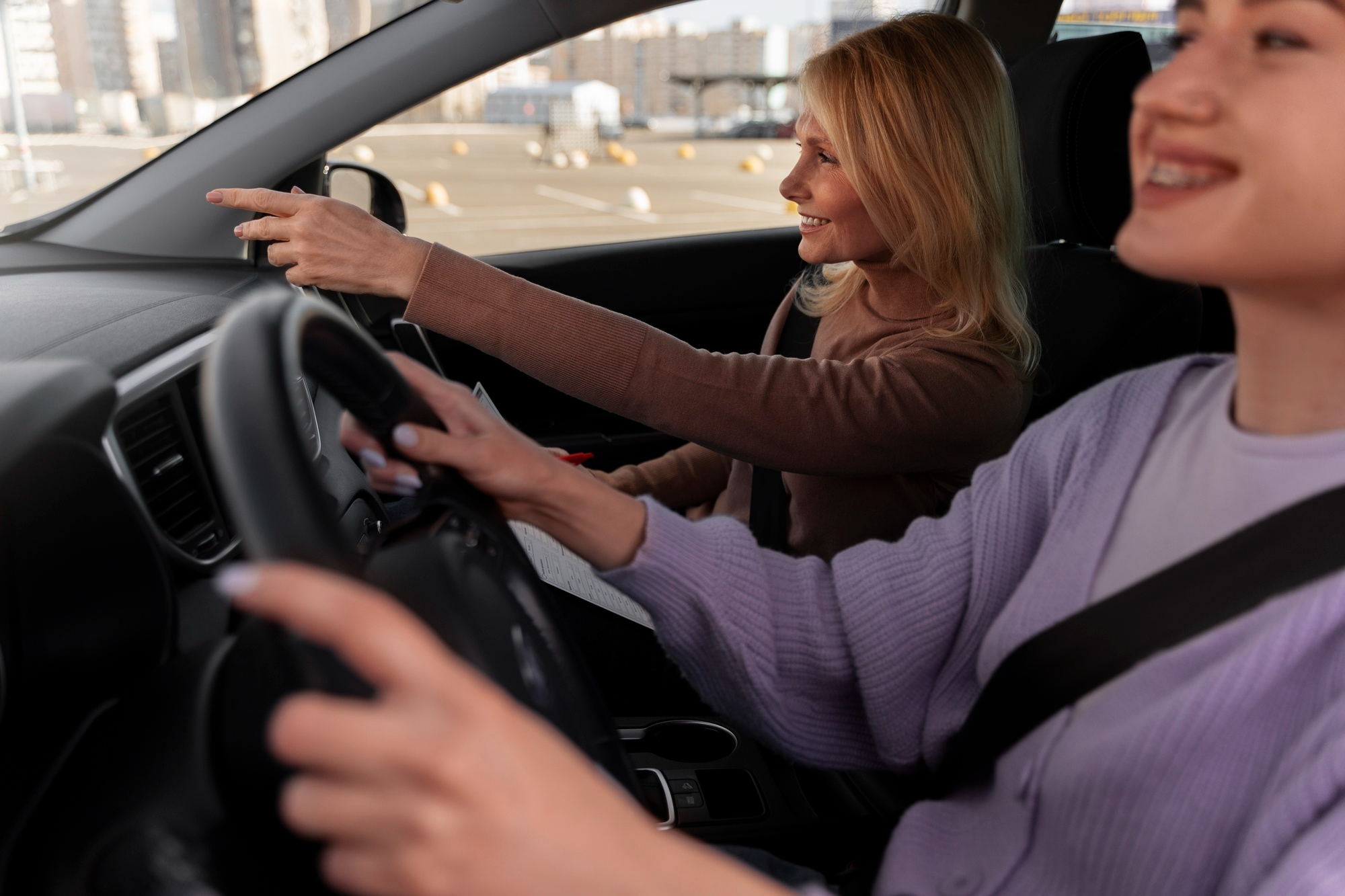 Student learning driving with instructor